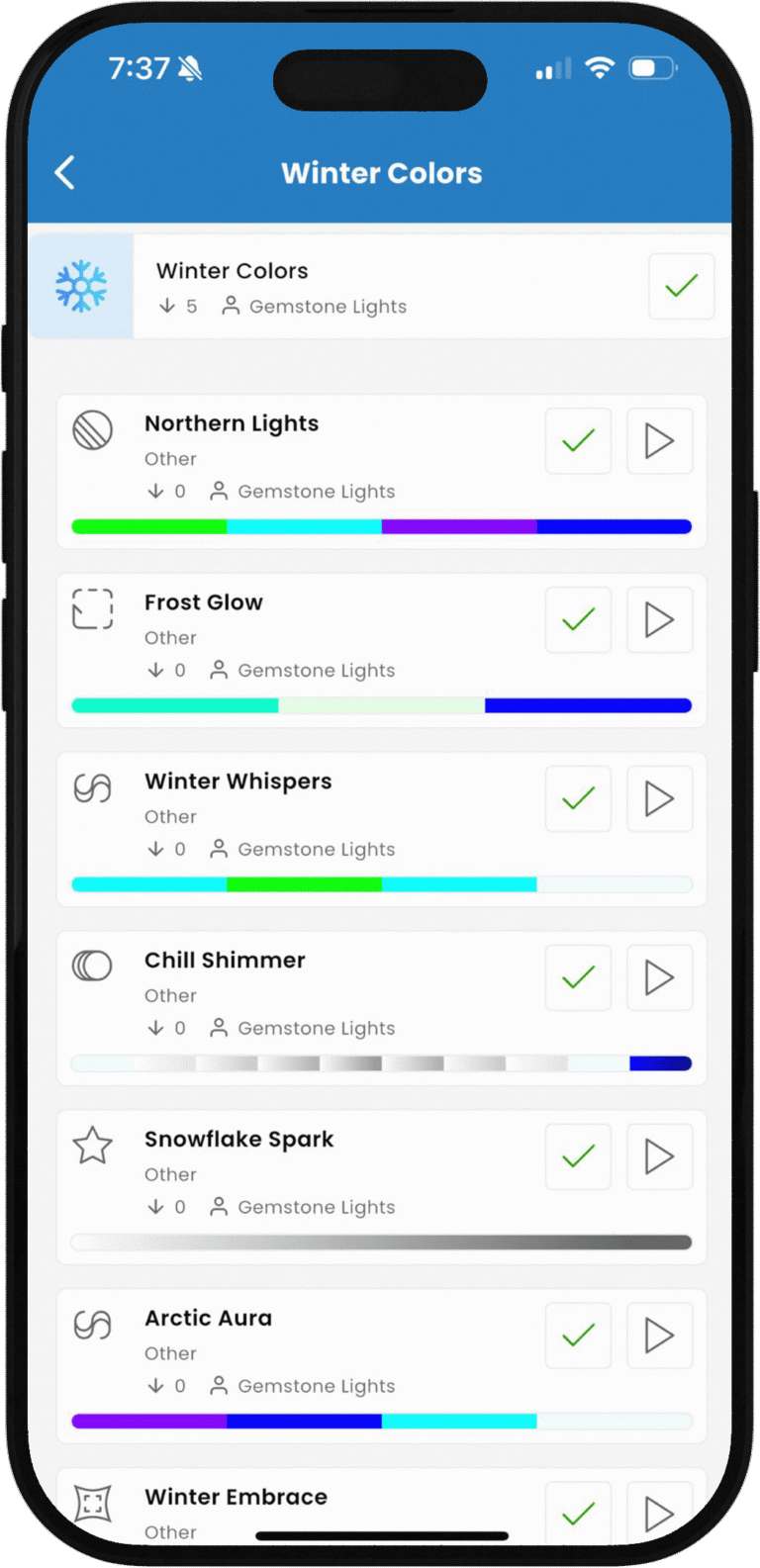 Spectrum Lighting Inc. iOS app screenshot: 'Winter Colors' folder on iPhone displaying winter-themed smart lighting presets including Winter Lights, Northern Lights, Frost Gem Lights, Winter Whispers, Chill Shimmer, Snowflake Spark, Arctic Aura, and Winter Embrace with customizable gem lights sliders and checkmarks.